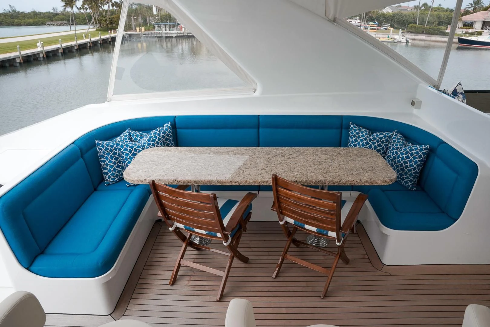 a table and chairs on a deck aboard HAU TREE Yacht for Sale
