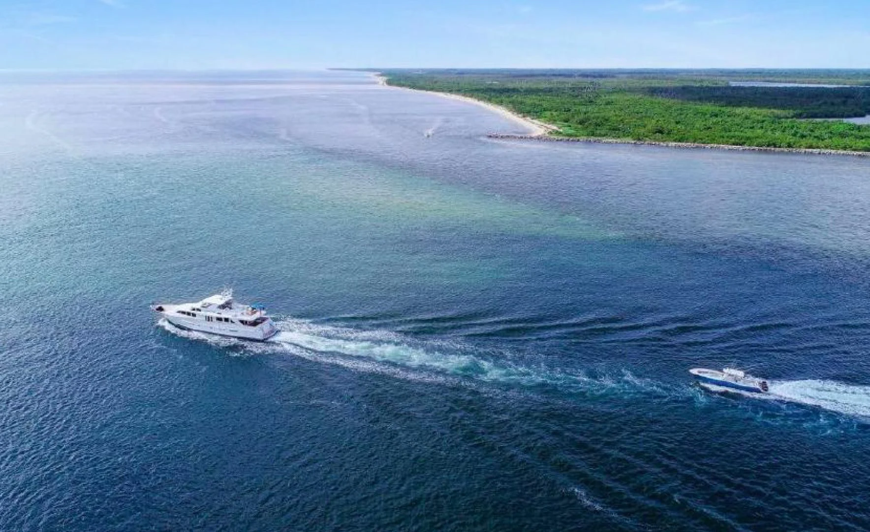 a boat sailing on the sea aboard HAU TREE Yacht for Sale