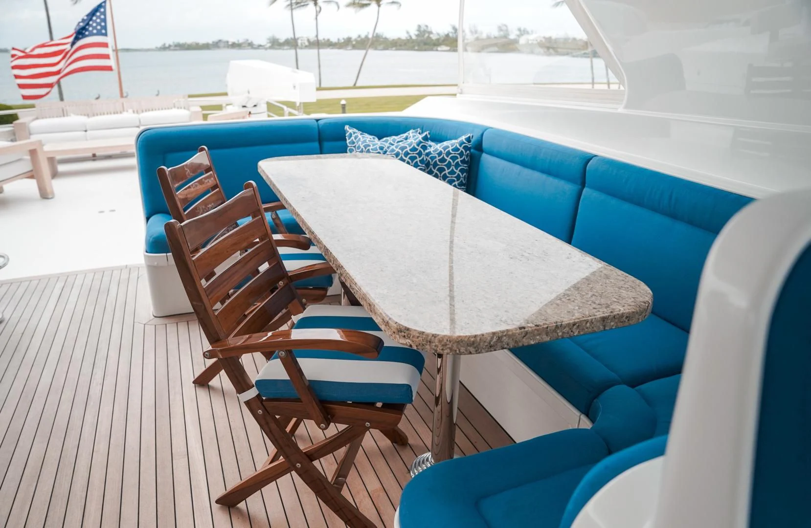 a table and chairs on a deck aboard HAU TREE Yacht for Sale
