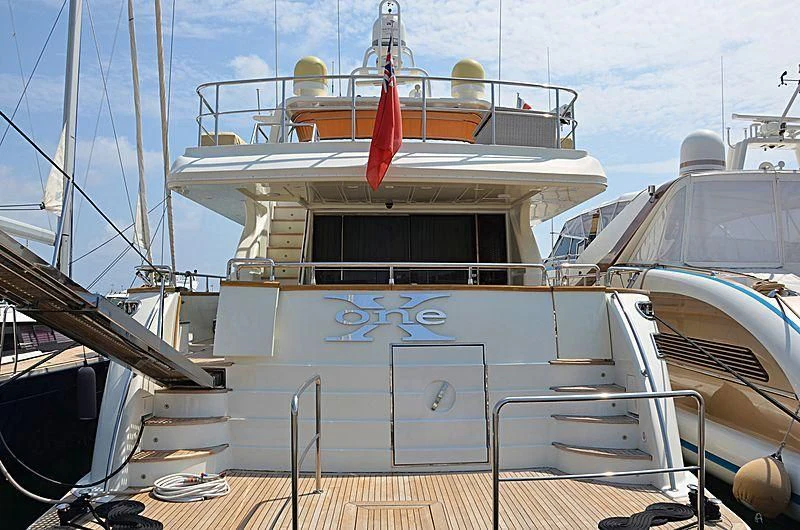 a boat docked at a pier aboard X ONE Yacht for Sale
