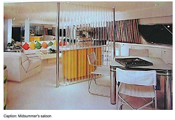 a room with a bed and desk aboard MIDSUMMER Yacht for Sale