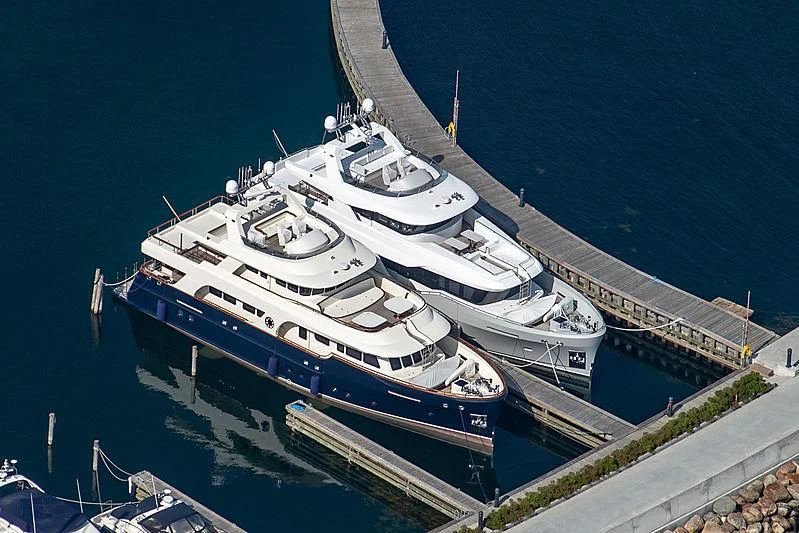 a large white boat on the water aboard POSEIDON Yacht for Sale