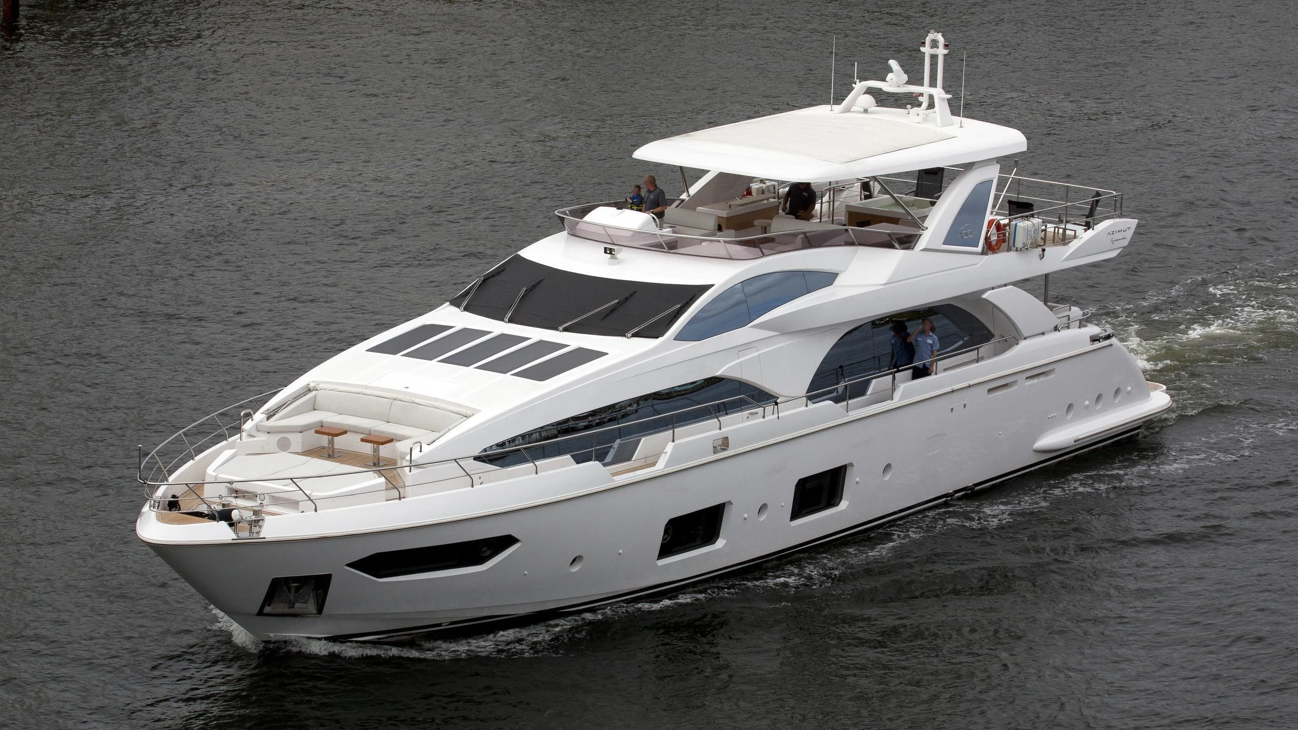 a white yacht on the water aboard LA TACHE Yacht for Sale