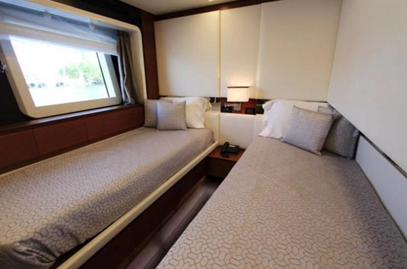 a room with two beds aboard LA TACHE Yacht for Sale