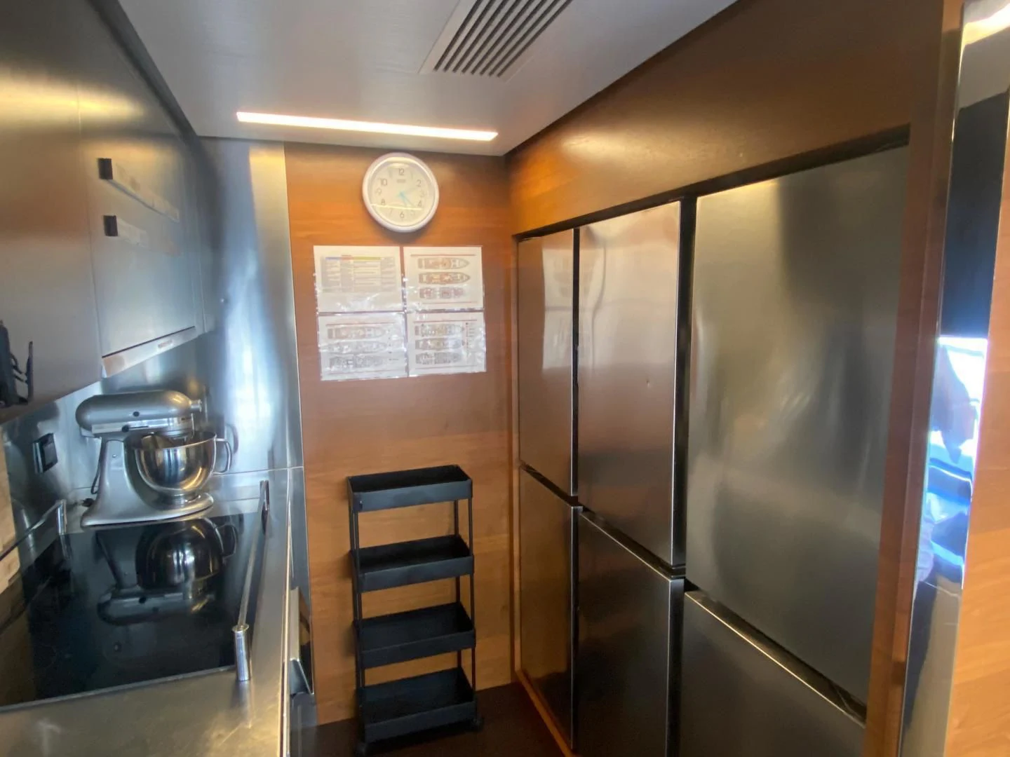 a kitchen with a glass door aboard LA TACHE Yacht for Sale
