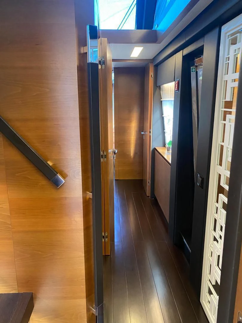 a hallway with doors aboard LA TACHE Yacht for Sale