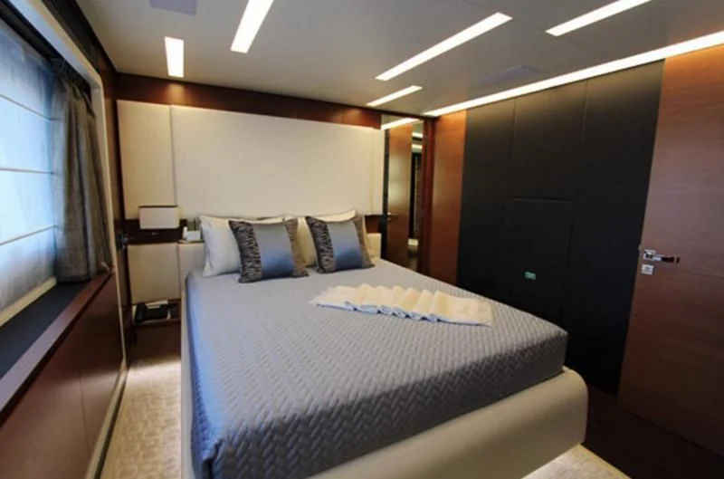 a bed in a room aboard LA TACHE Yacht for Sale