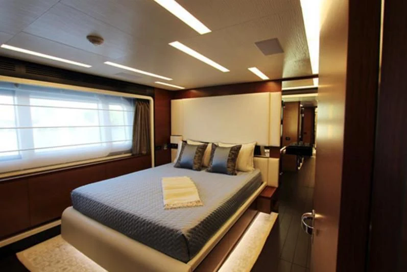 a bed in a room aboard LA TACHE Yacht for Sale