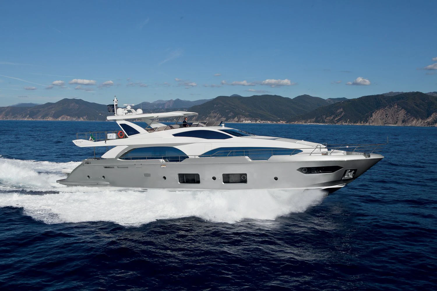a yacht on the water aboard LA TACHE Yacht for Sale