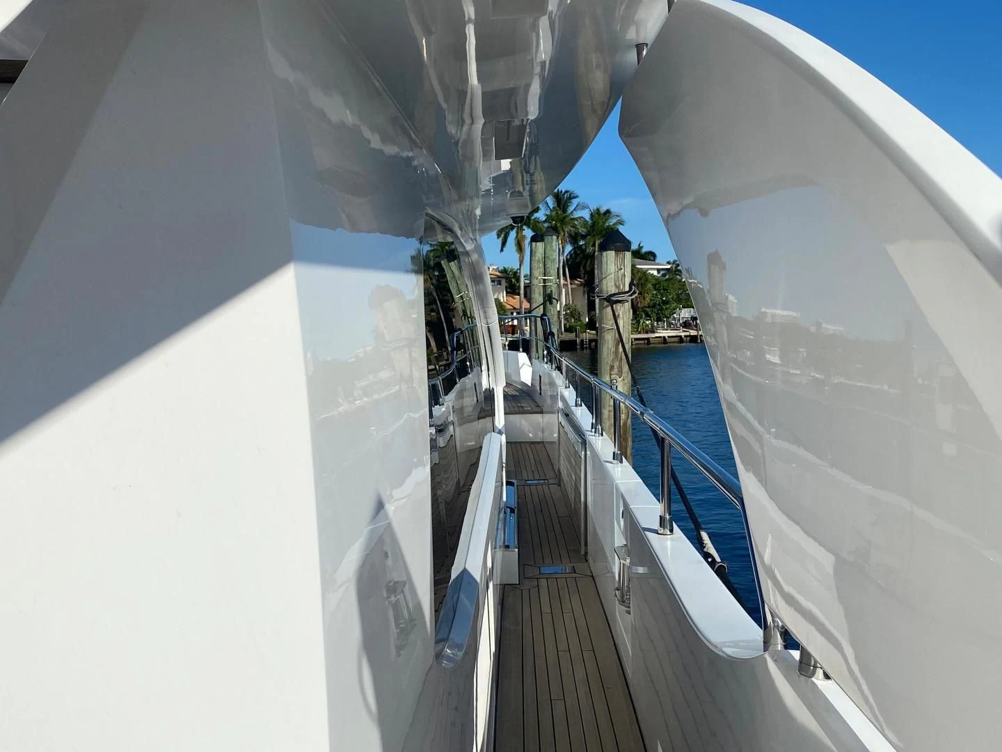 a long dock with a building in the background aboard LA TACHE Yacht for Sale