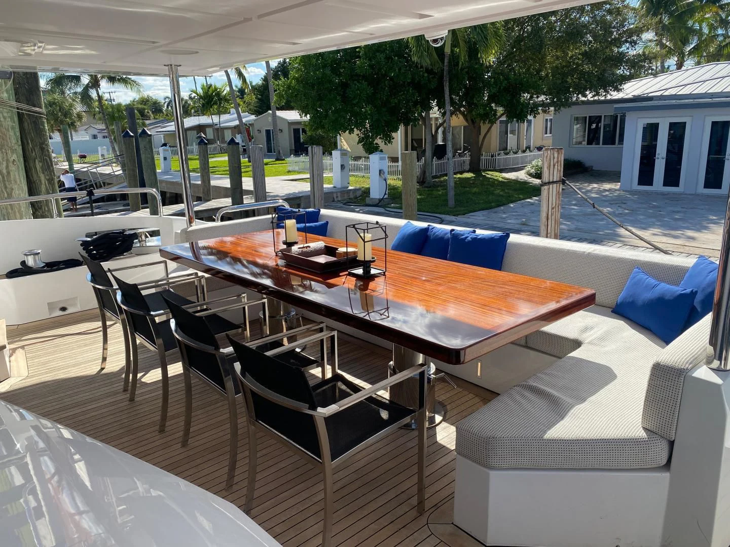 a table and chairs outside aboard LA TACHE Yacht for Sale