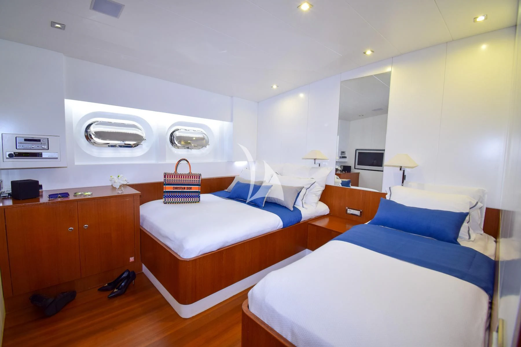 a room with a couple beds aboard UBI BENE Yacht for Charter