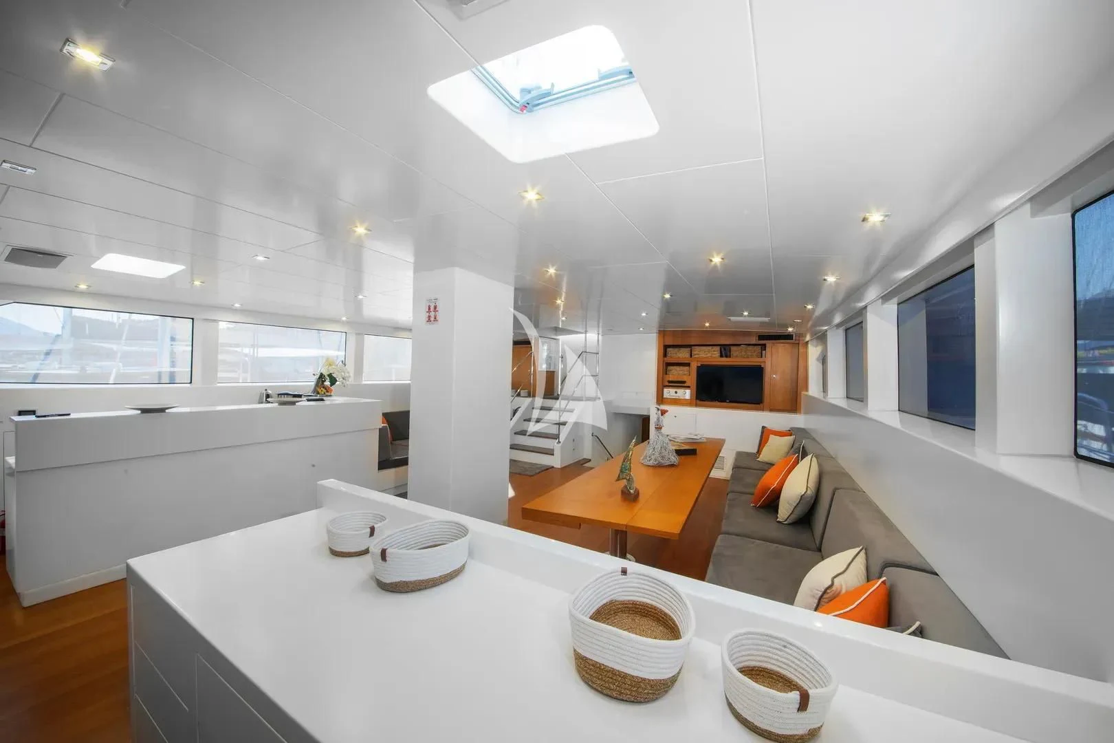 a modern kitchen with white counter tops aboard UBI BENE Yacht for Charter