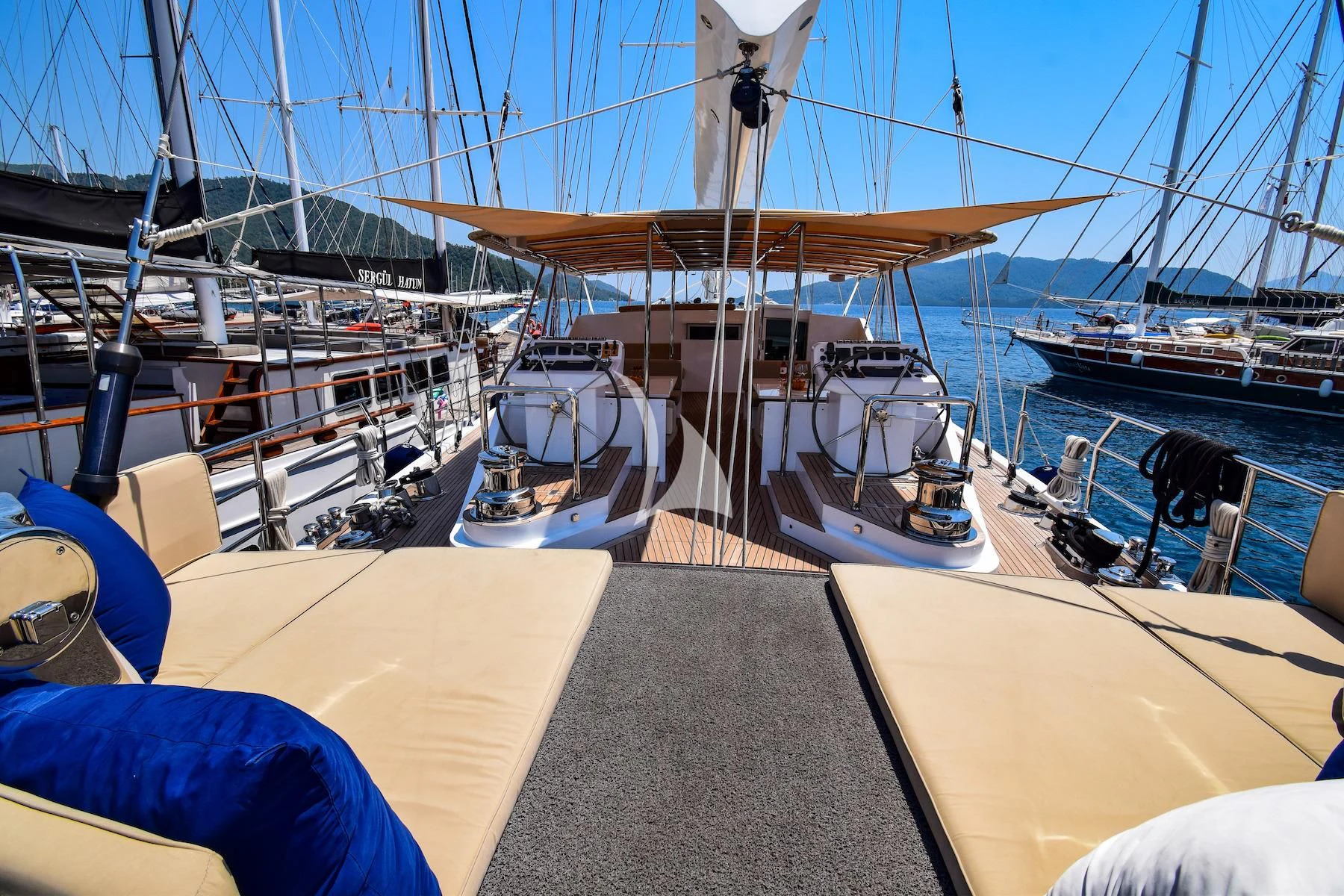 a boat dock with boats aboard UBI BENE Yacht for Charter