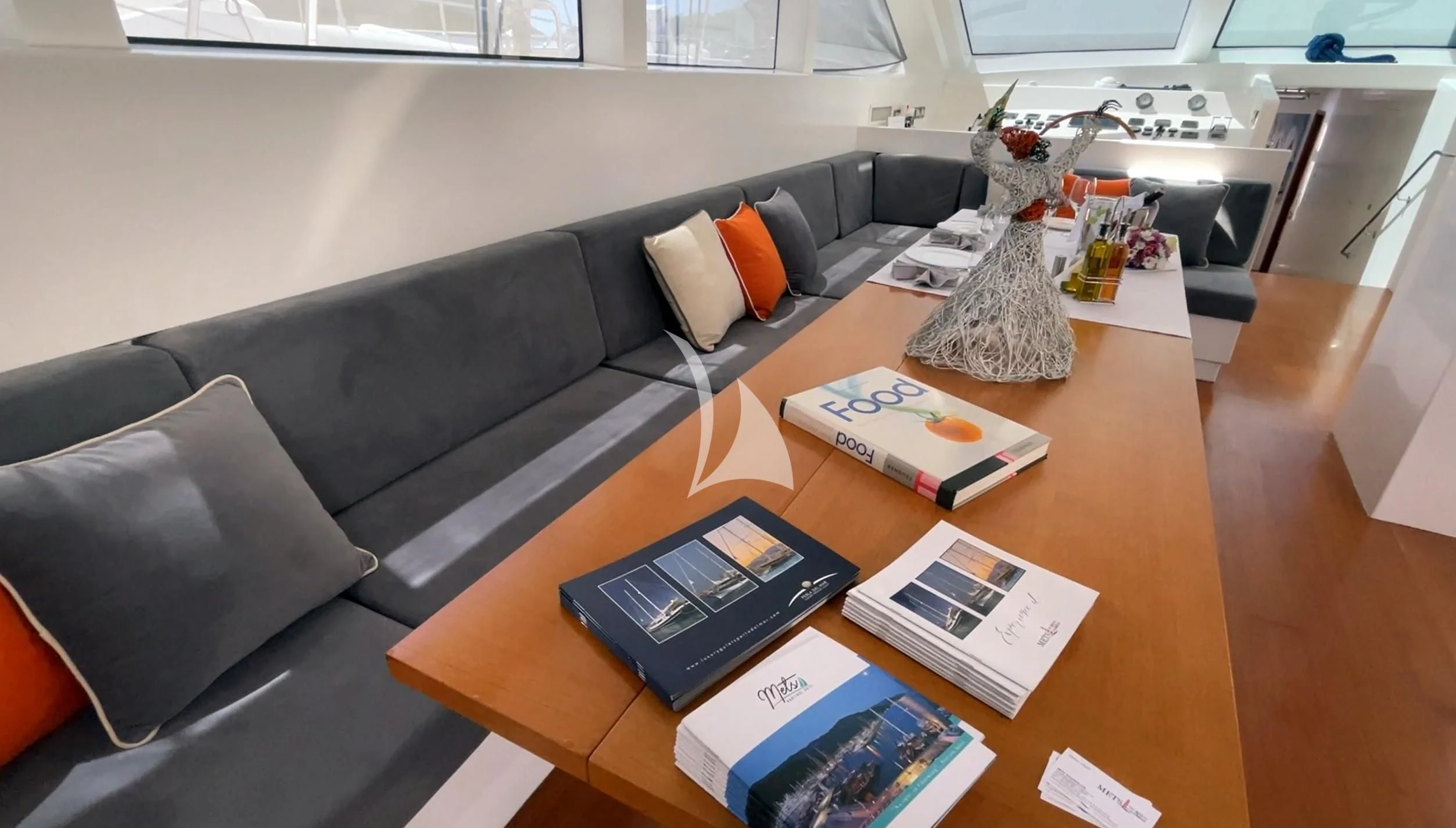 a living room with a couch and coffee table aboard UBI BENE Yacht for Charter