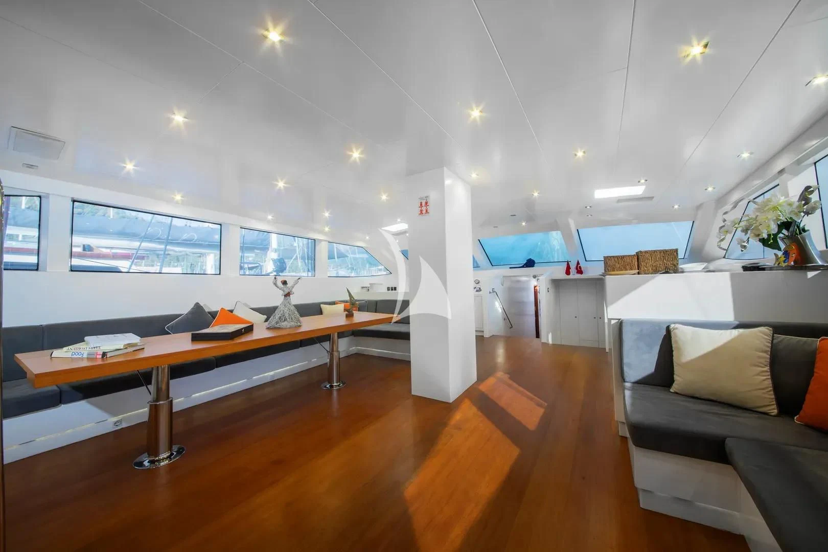 a room with a couch and a table aboard UBI BENE Yacht for Charter
