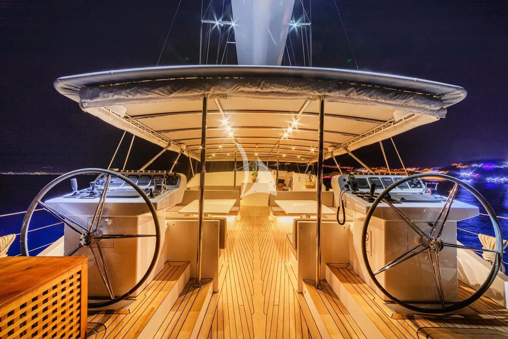 a large white and black tent with lights on it aboard UBI BENE Yacht for Charter