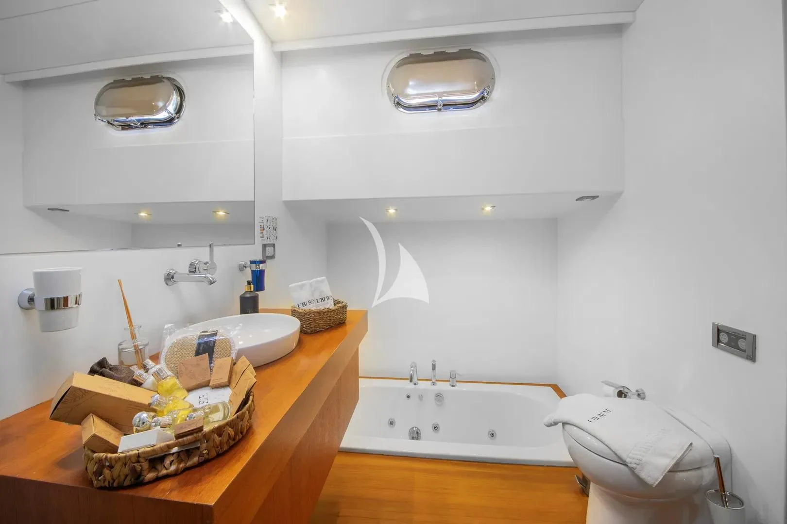 a bathroom with a sink and a mirror aboard UBI BENE Yacht for Charter