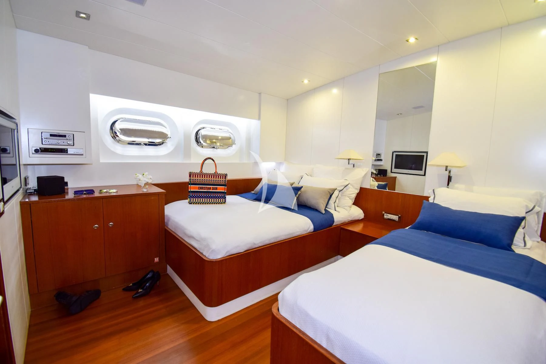a bedroom with a bed and a desk aboard UBI BENE Yacht for Charter