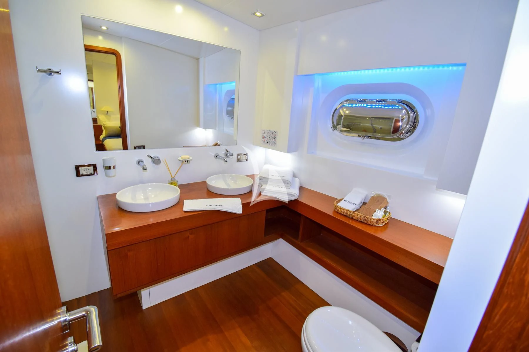 a bathroom with a sink and a mirror aboard UBI BENE Yacht for Charter