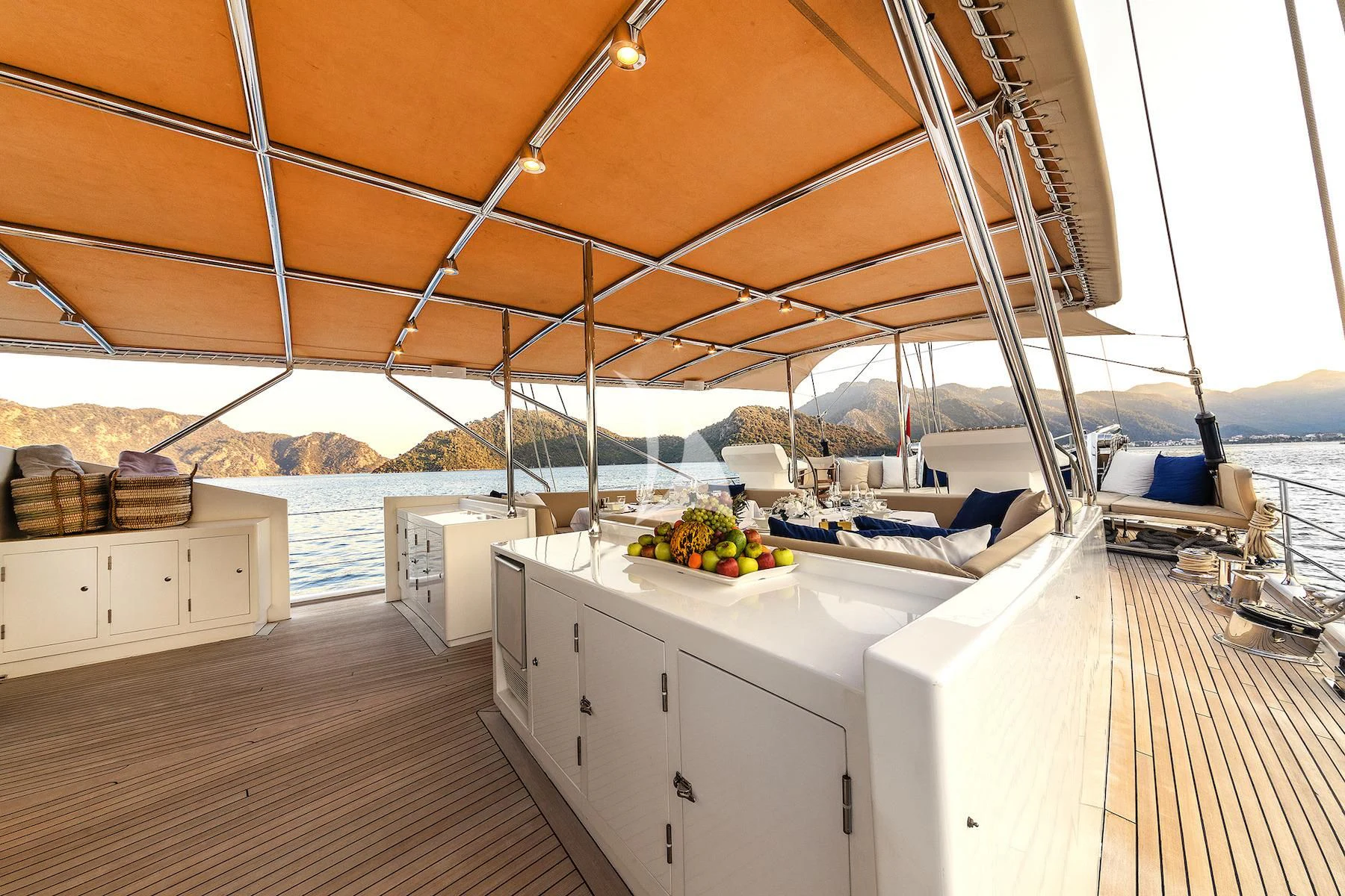 a large open roof with a view of the ocean and the mountains aboard UBI BENE Yacht for Charter