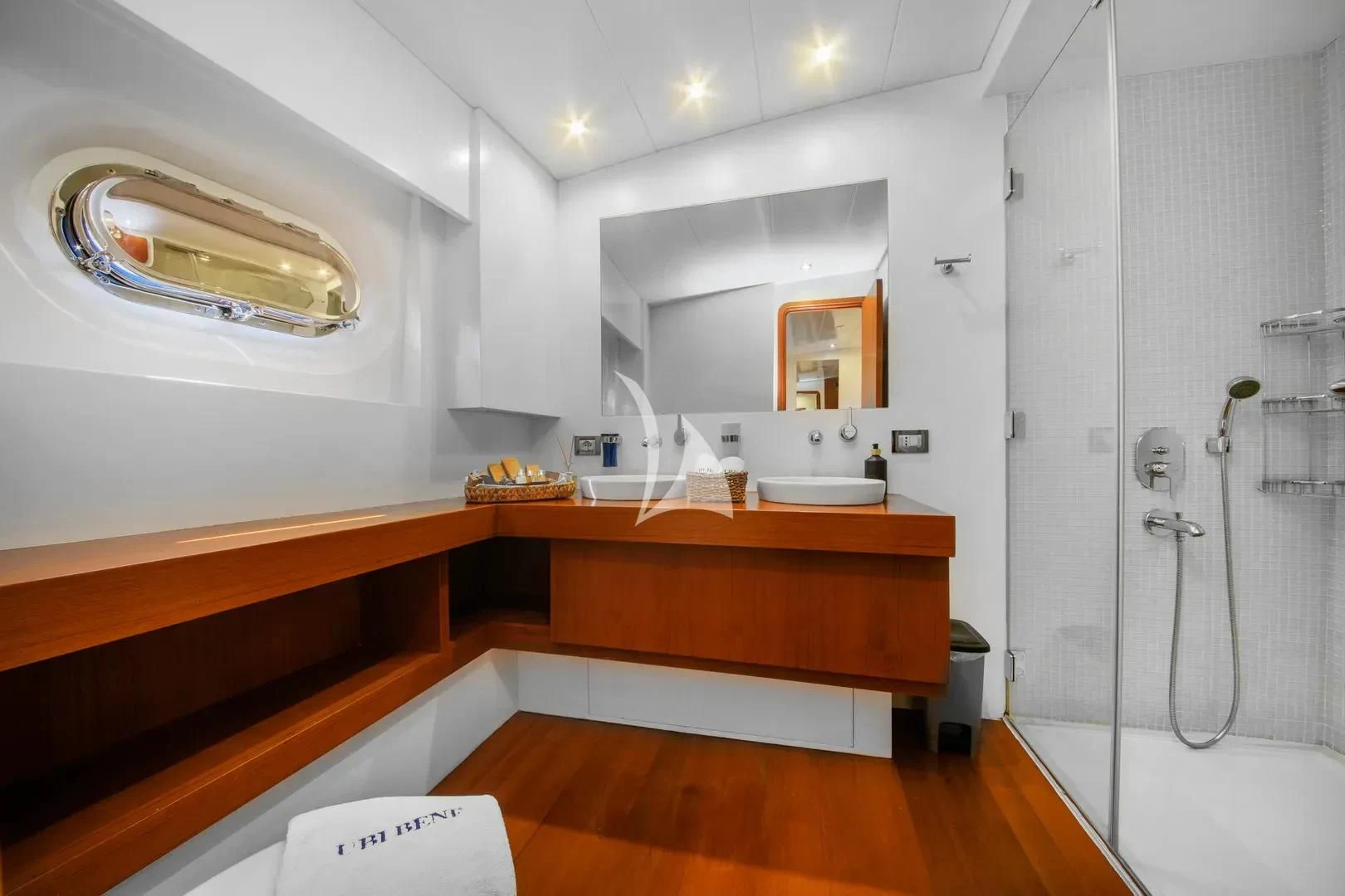 a bathroom with a sink and a shower aboard UBI BENE Yacht for Charter