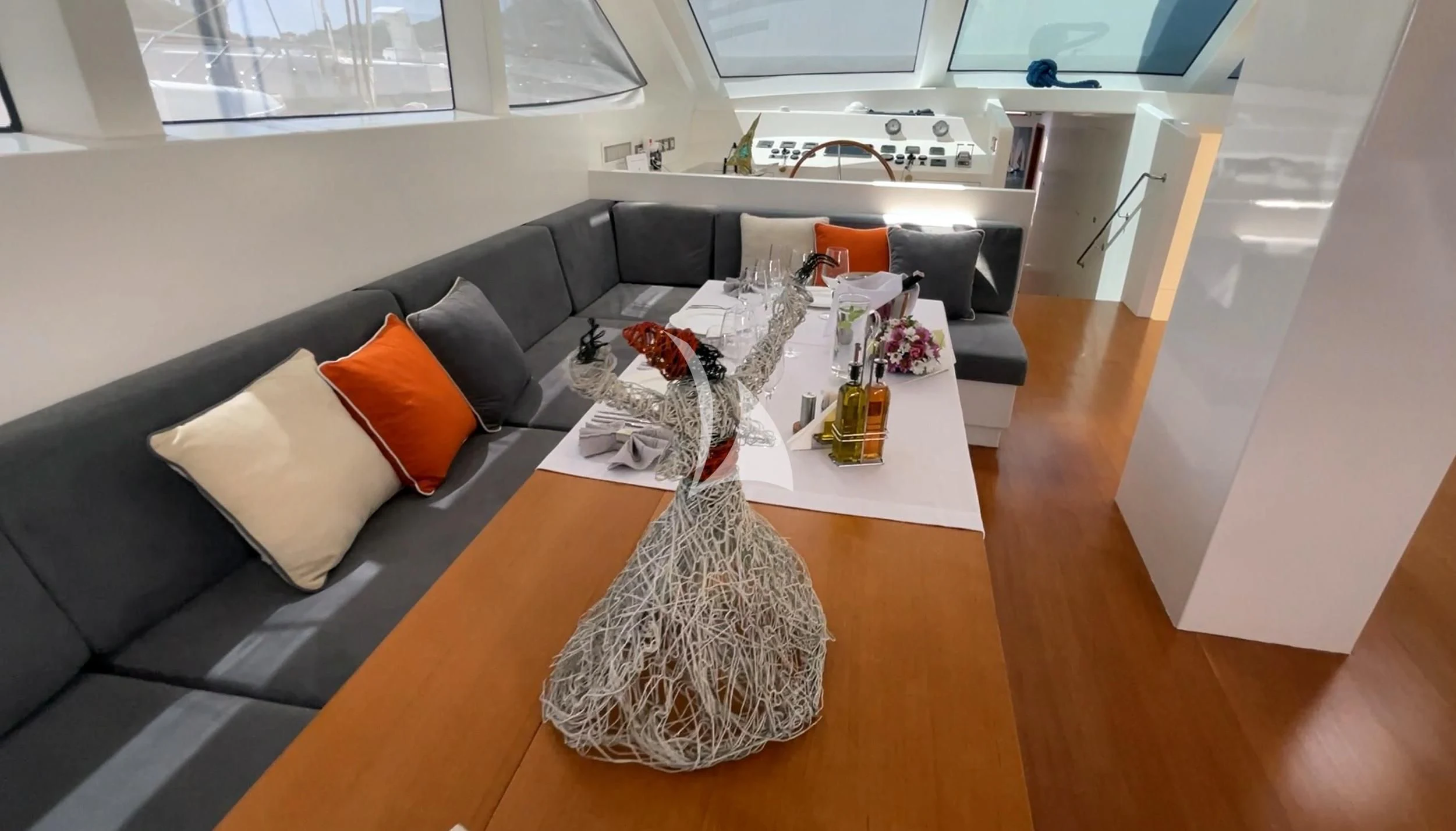 a living room with a couch and a table aboard UBI BENE Yacht for Charter