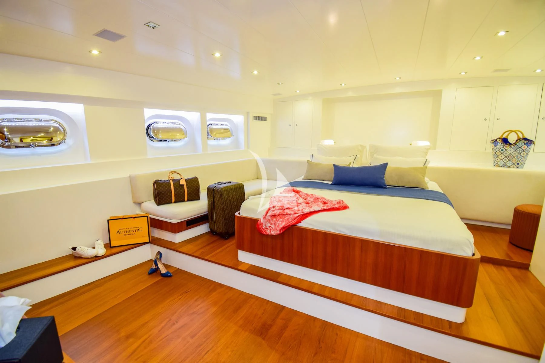 a bedroom with a large bed aboard UBI BENE Yacht for Charter