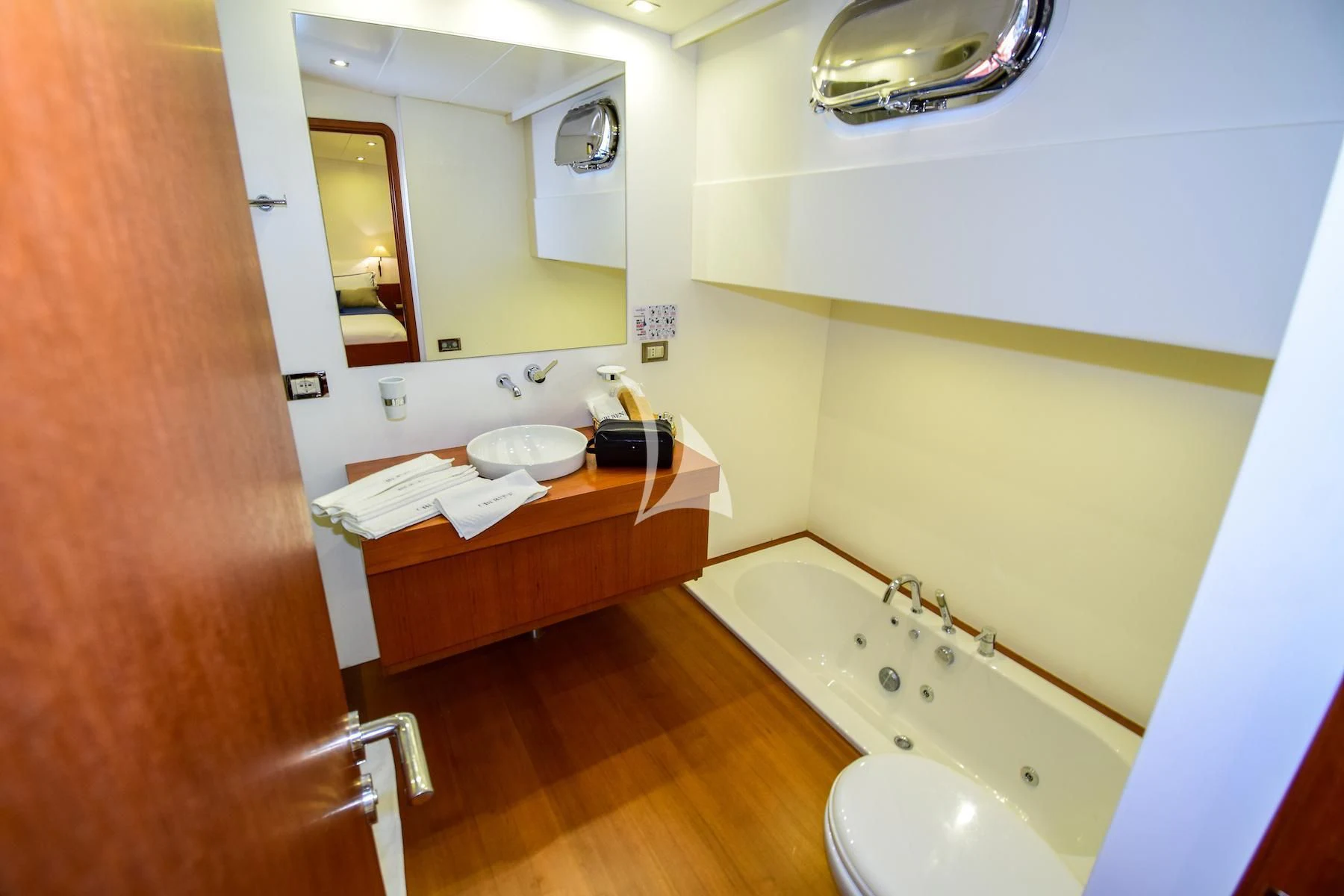 a bathroom with a sink and a bathtub aboard UBI BENE Yacht for Charter
