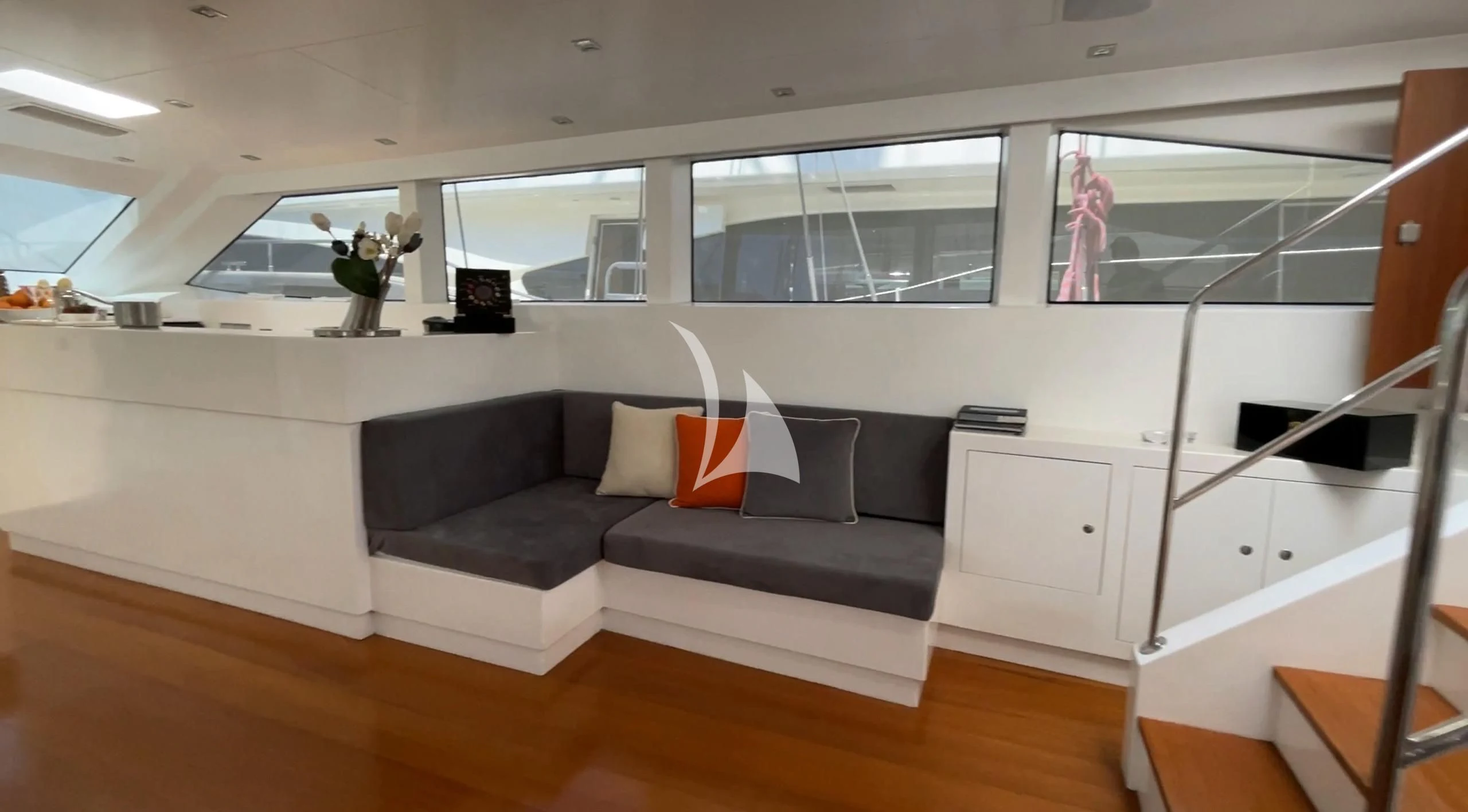 a room with a couch and a window aboard UBI BENE Yacht for Charter