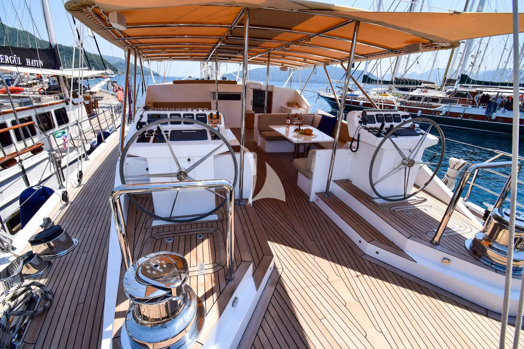 a boat docked at a pier aboard UBI BENE Yacht for Charter