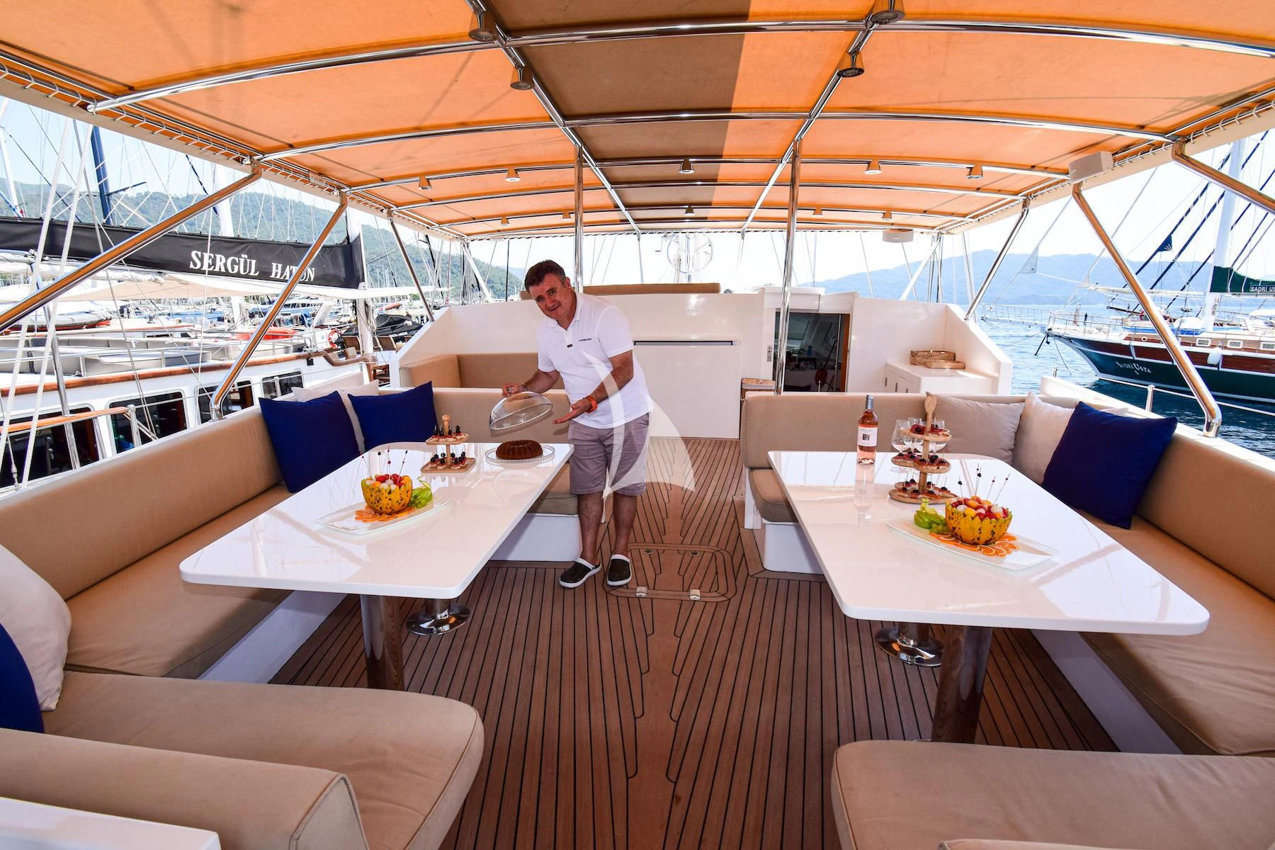 a person standing on a boat aboard UBI BENE Yacht for Charter