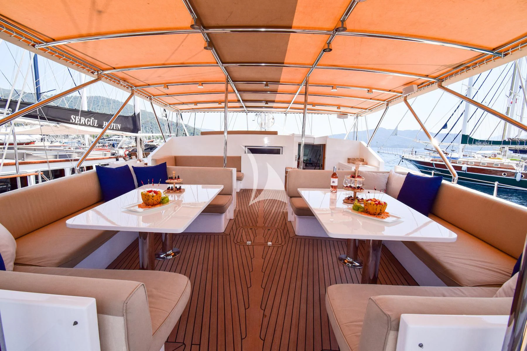 a boat with a table and chairs aboard UBI BENE Yacht for Charter