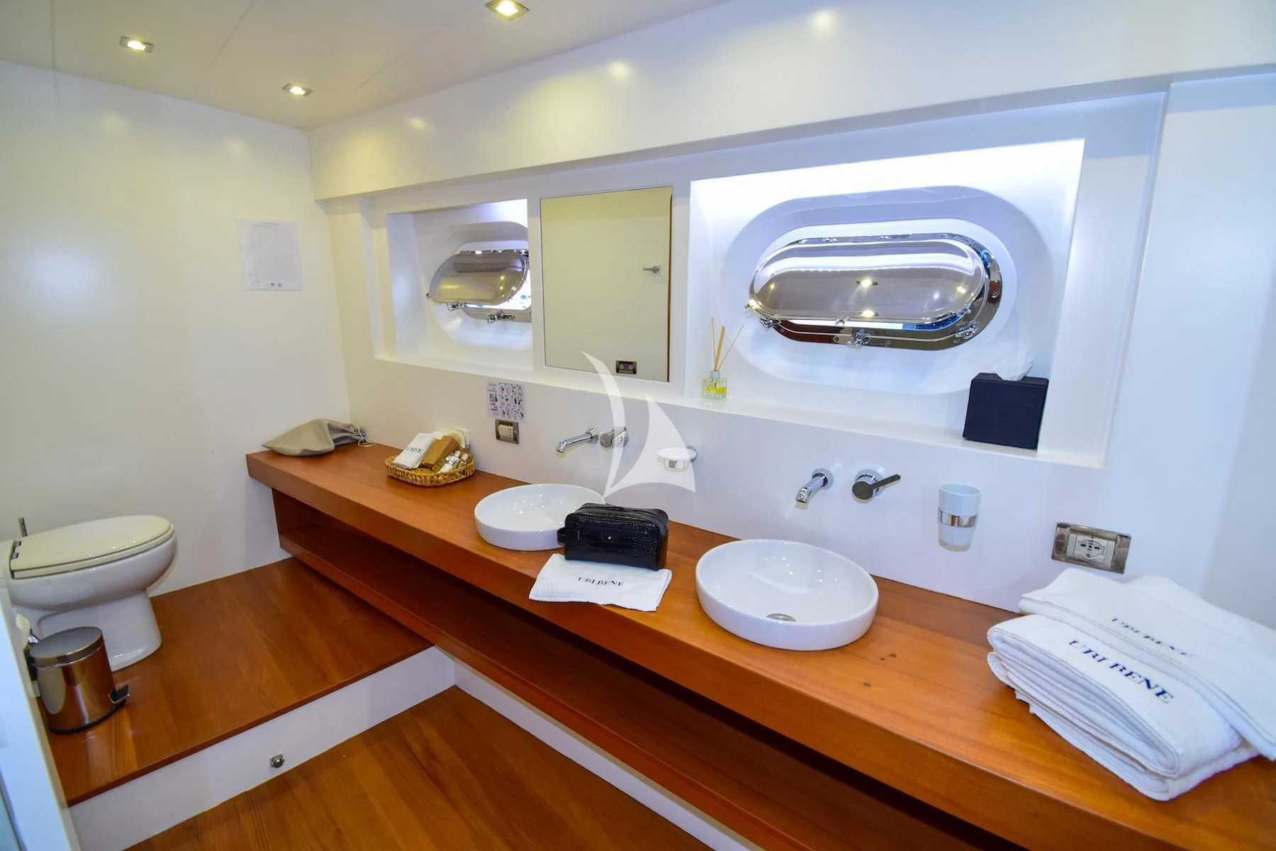 a bathroom with a sink and toilet aboard UBI BENE Yacht for Charter