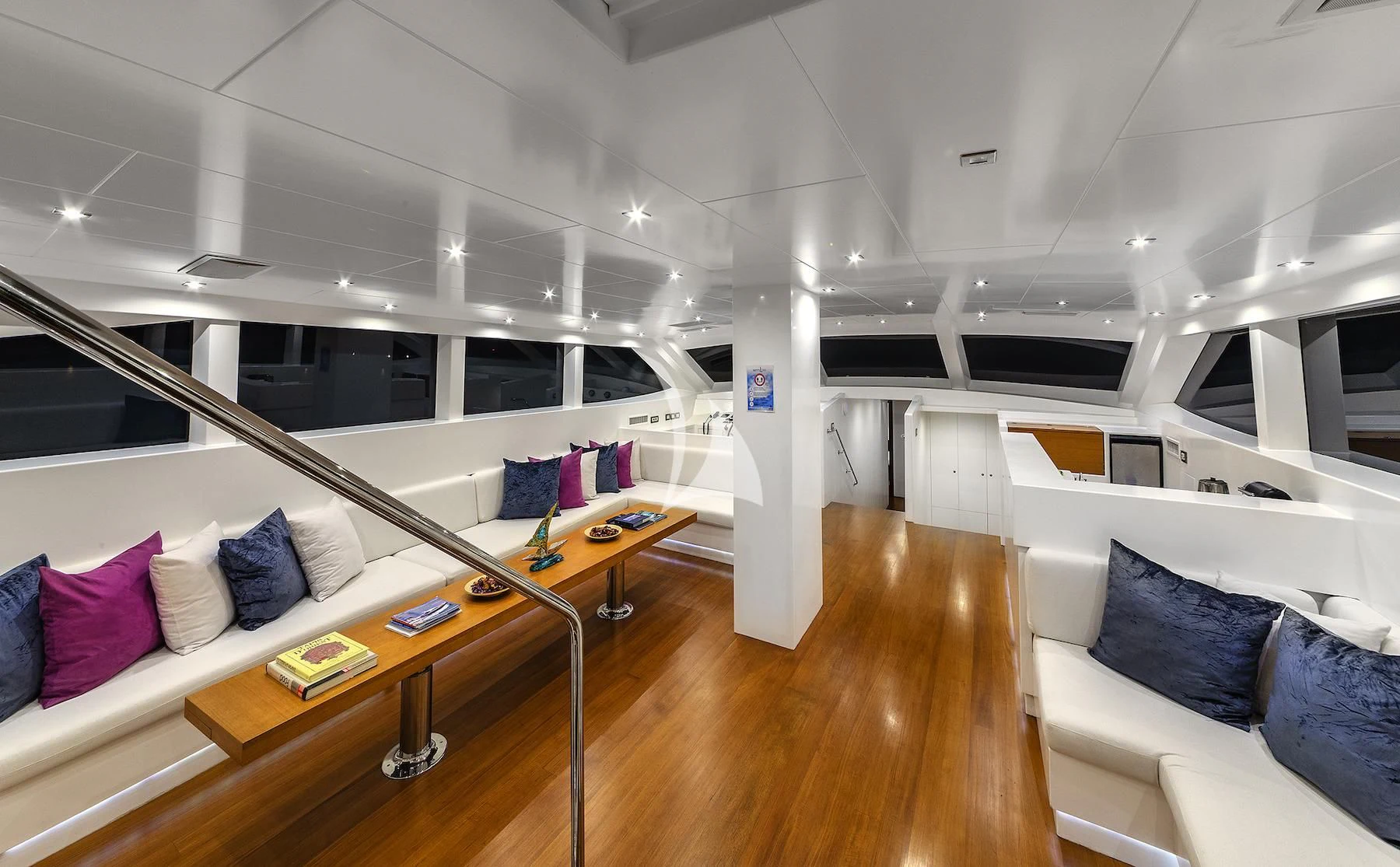 a room with a table and couches aboard UBI BENE Yacht for Charter