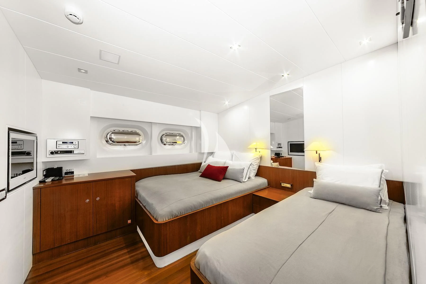 a bedroom with a bed and a desk aboard UBI BENE Yacht for Charter