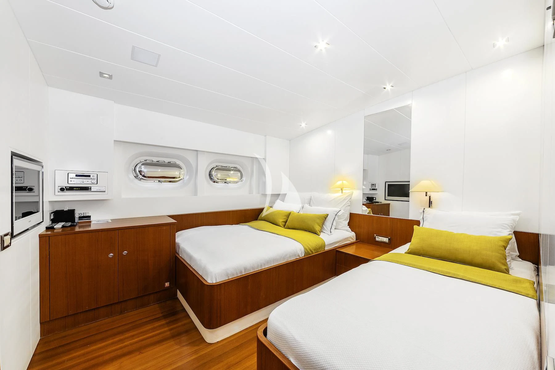 a room with a couple of beds aboard UBI BENE Yacht for Charter