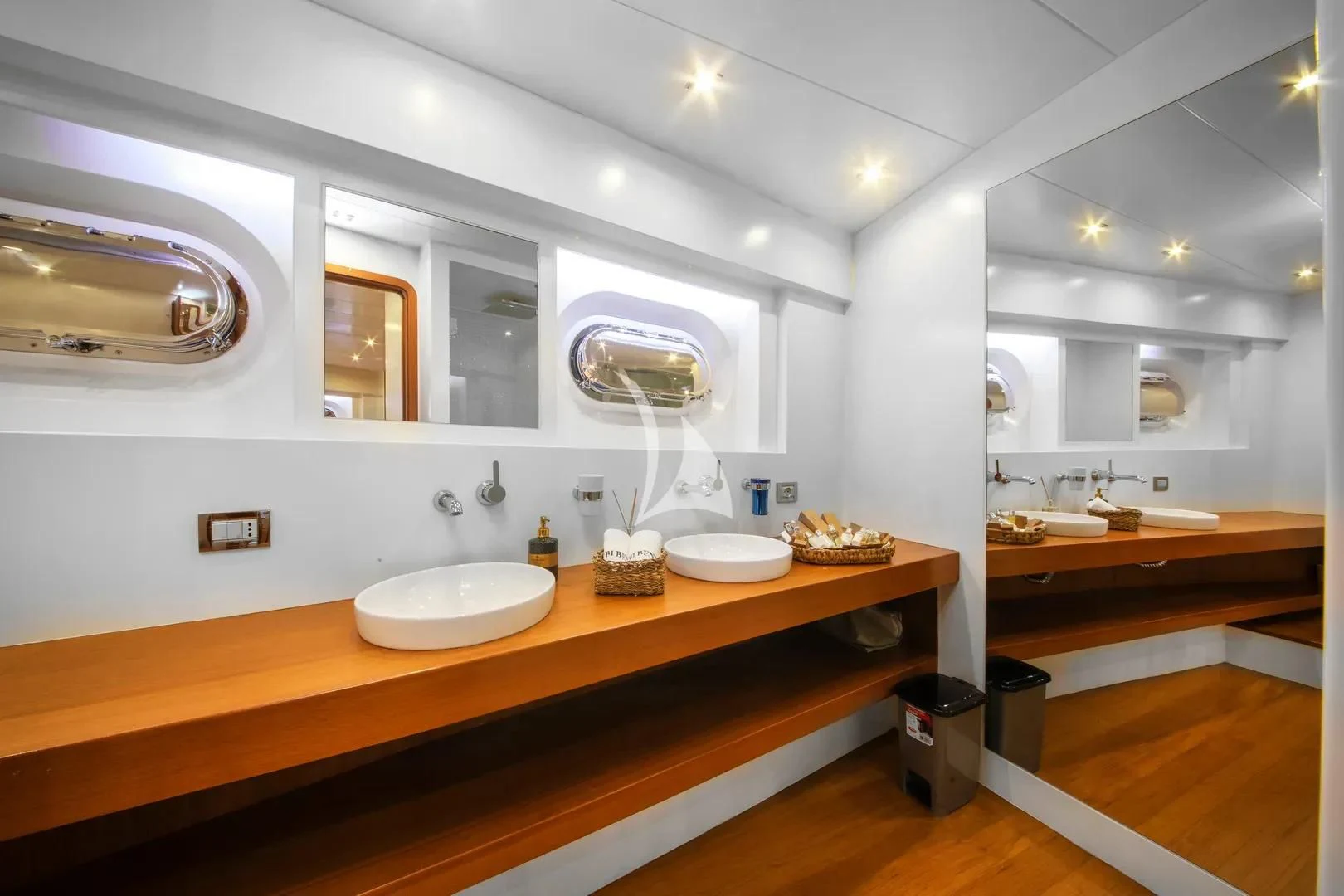 a bathroom with sinks and mirrors aboard UBI BENE Yacht for Charter
