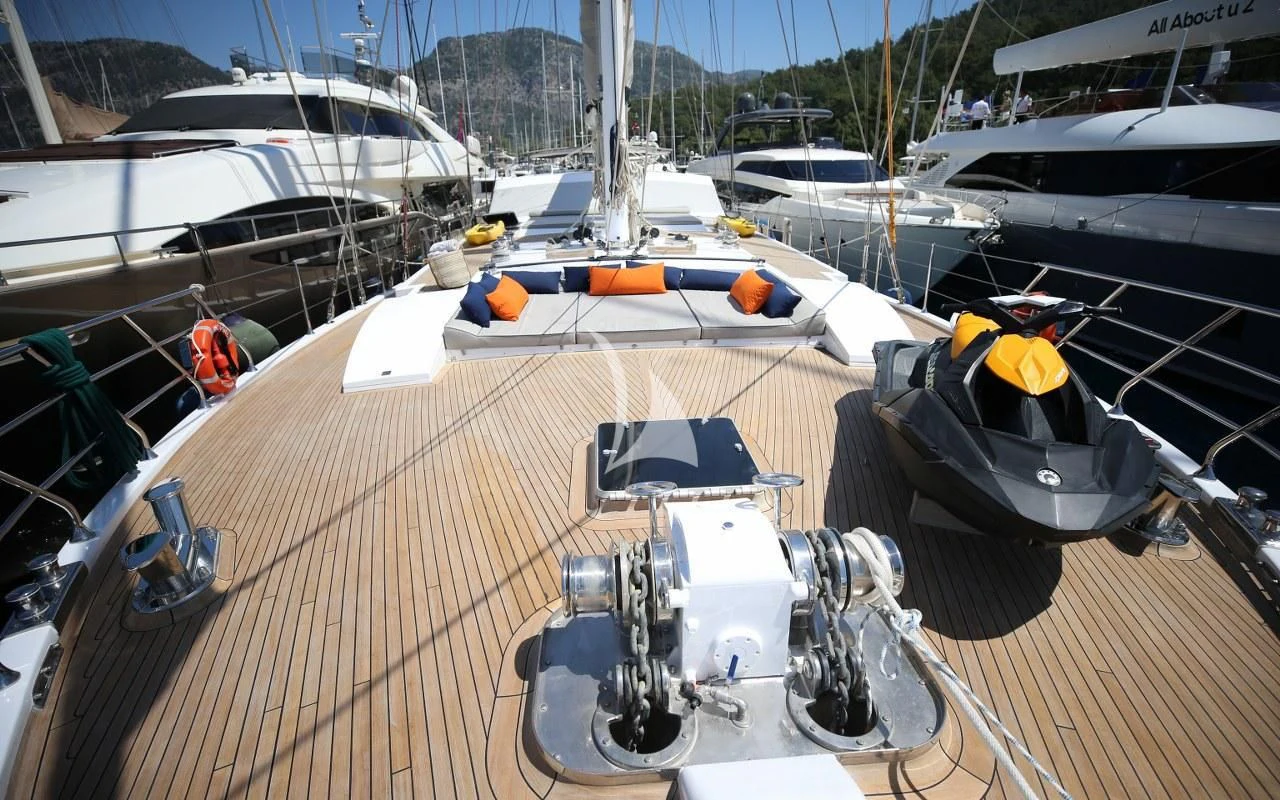 a boat docked at a pier aboard UBI BENE Yacht for Charter