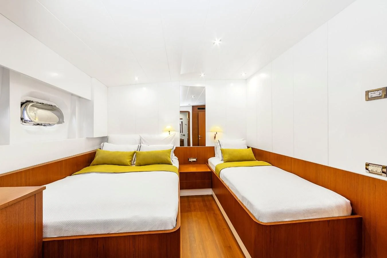 a room with a bed and a desk aboard UBI BENE Yacht for Charter