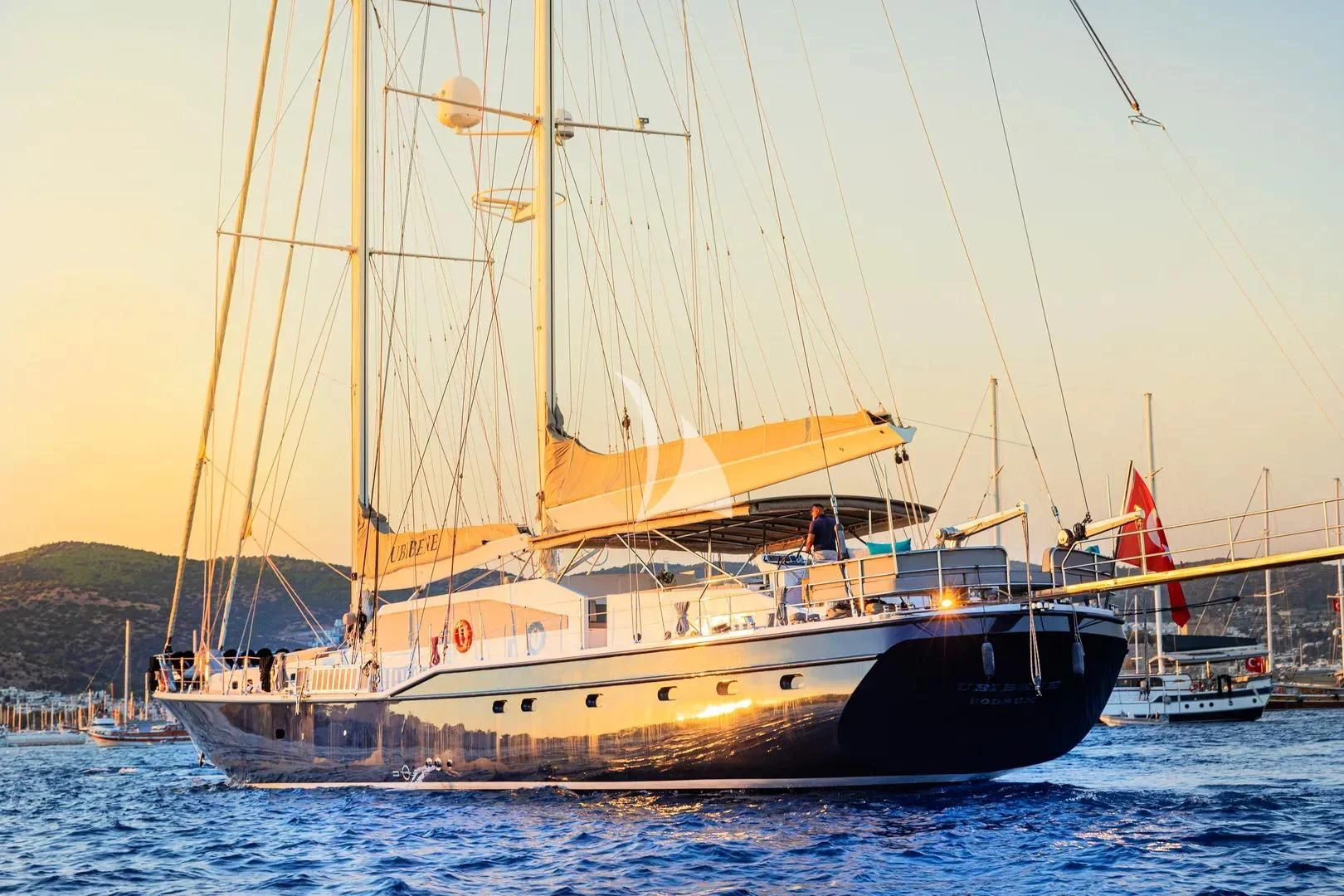 a large sailboat in the water aboard UBI BENE Yacht for Charter