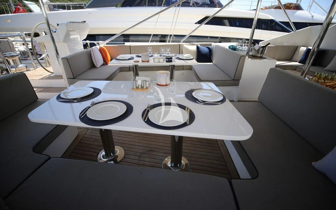 a table with plates and cups on it aboard UBI BENE Yacht for Charter
