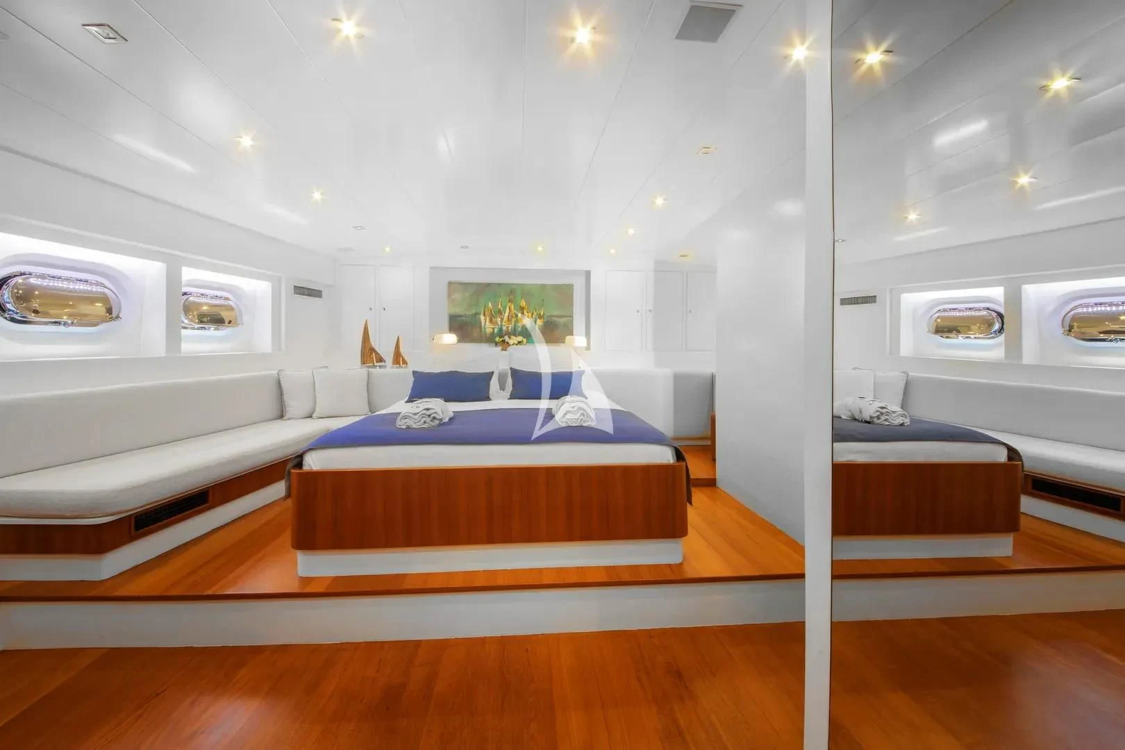 a room with a bed and a table aboard UBI BENE Yacht for Charter