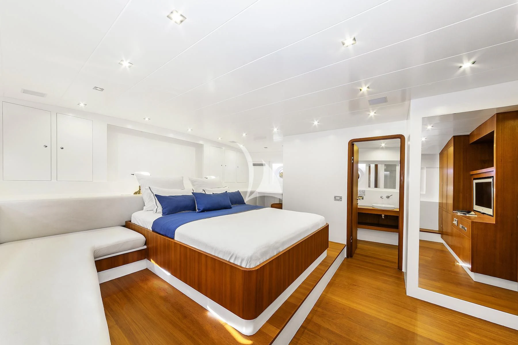 a room with a bed and a mirror aboard UBI BENE Yacht for Charter