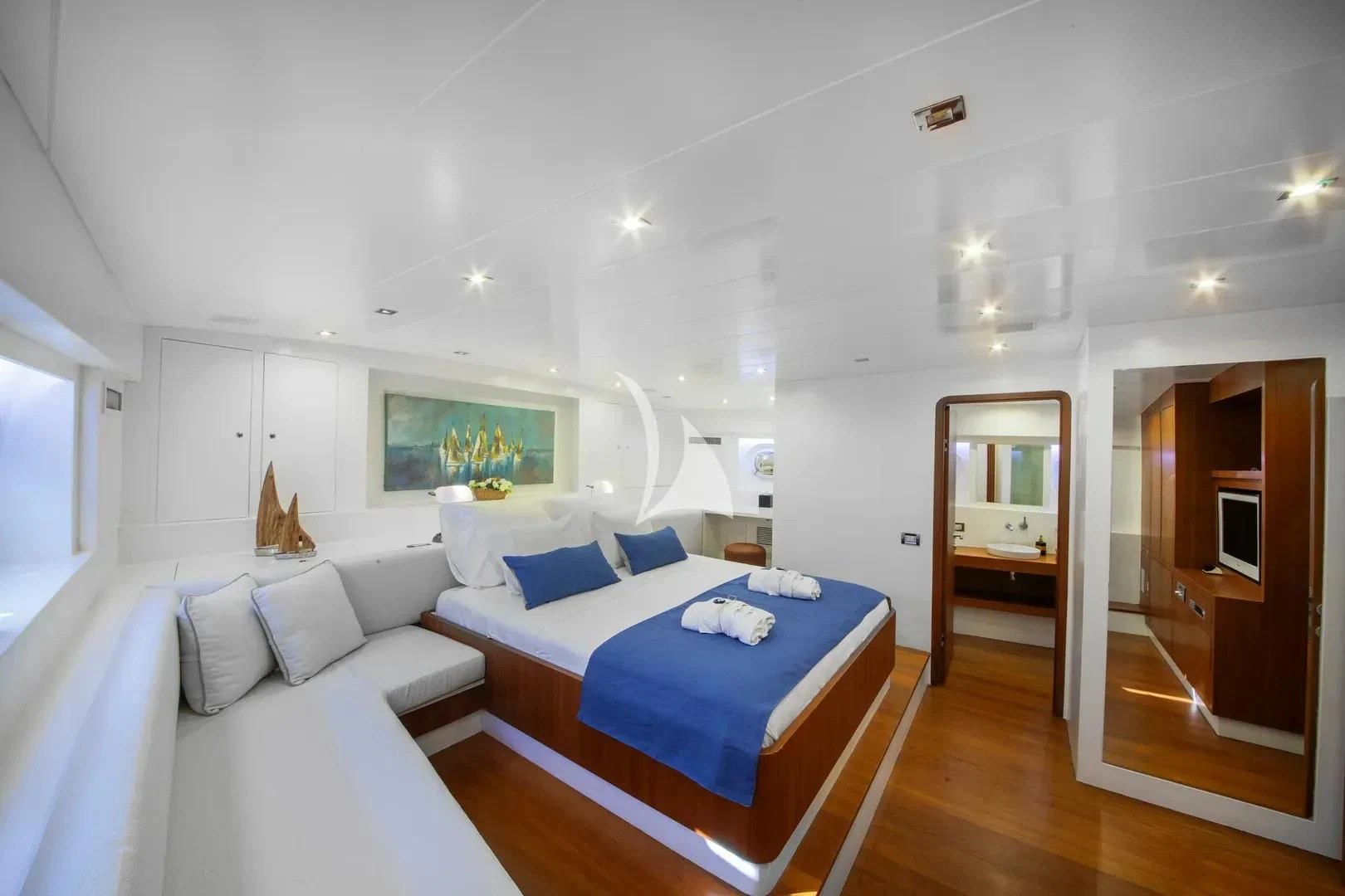 a room with a bed and a mirror aboard UBI BENE Yacht for Charter