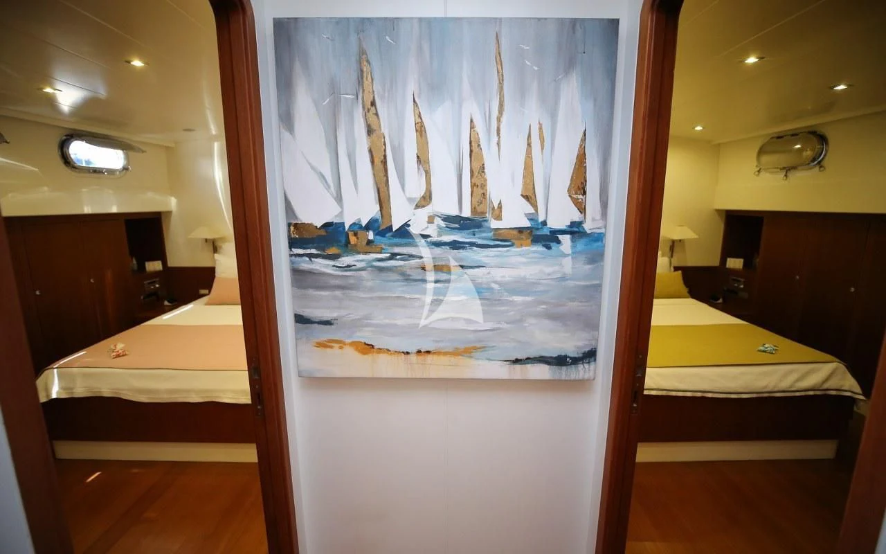 a room with a large painting aboard UBI BENE Yacht for Charter