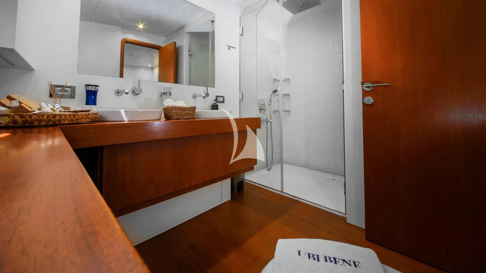 a kitchen with a countertop sink and cabinets aboard UBI BENE Yacht for Charter