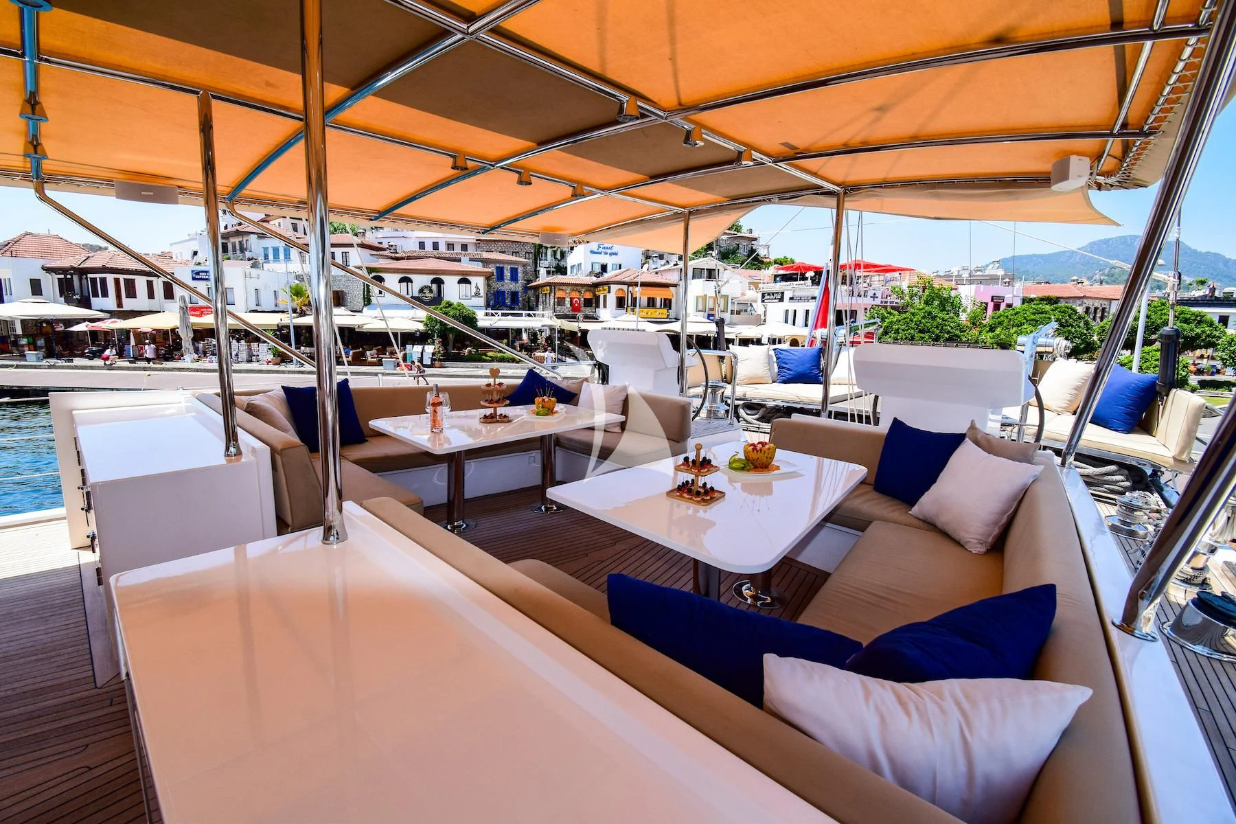 a boat with tables and chairs aboard UBI BENE Yacht for Charter