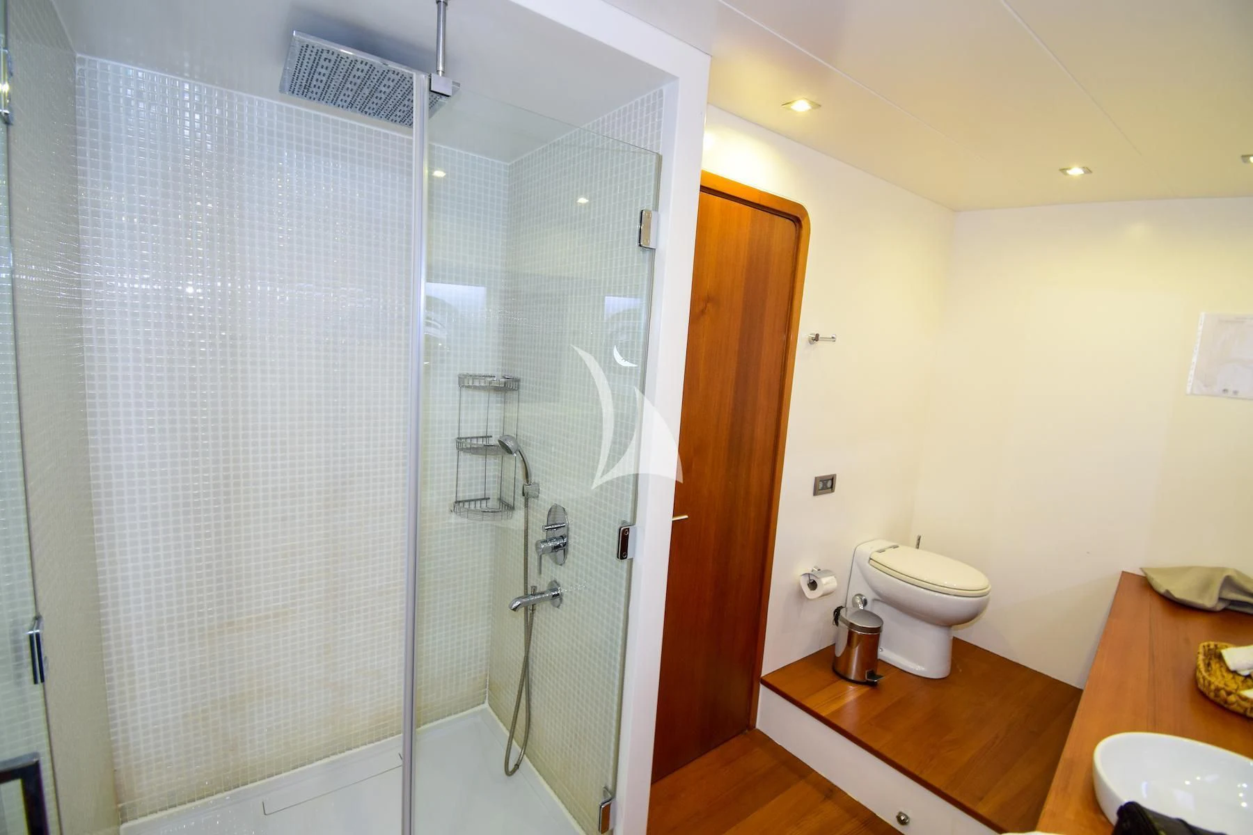 a bathroom with a glass shower aboard UBI BENE Yacht for Charter