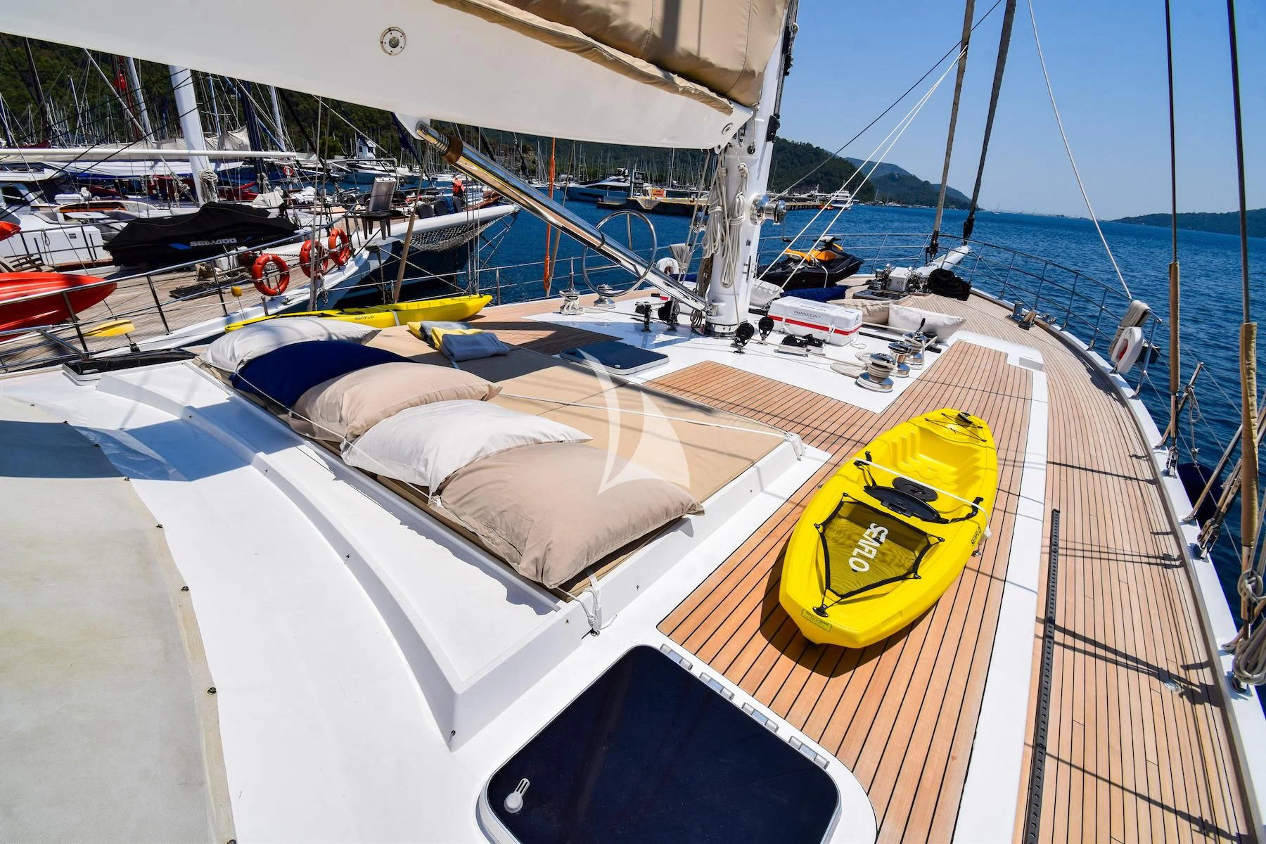 a boat docked at a pier aboard UBI BENE Yacht for Charter